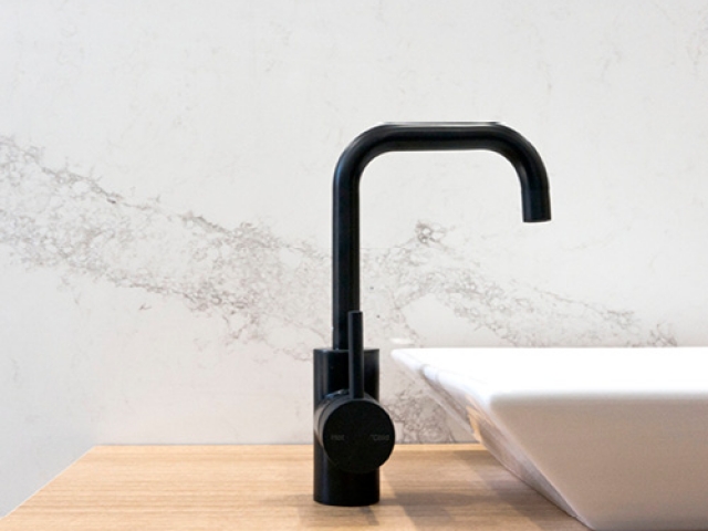 Calacatta-nuvo-stone-bathroom-wall-lining-bathroom-vanity-above-counter-basin-black-tap-