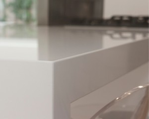 white-stone-kitchen-benchtop-80mm-mitred-edge-barely-visible-join-lines-close-up-artarmon-benchmark-stonemasons.jpg