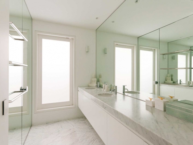 Photo of Glenn McGrath's new bathroom vanity featuring CDK Stone cararra marble benchtop, made by Benchmark Stonemasons, Sydney