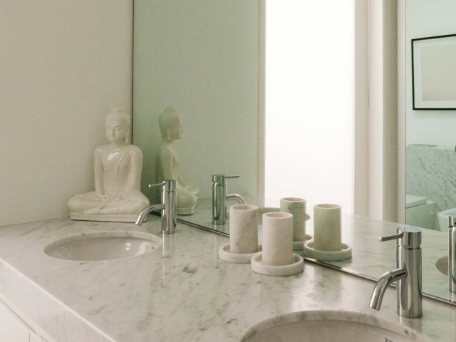 Photo of Glenn McGrath's new bathroom vanity featuring CDK Stone cararra marble benchtop, made by Benchmark Stonemasons, Sydney