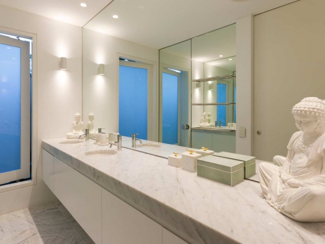 Photo of Glenn McGrath's new bathroom vanity featuring CDK Stone cararra marble benchtop, made by Benchmark Stonemasons, Sydney