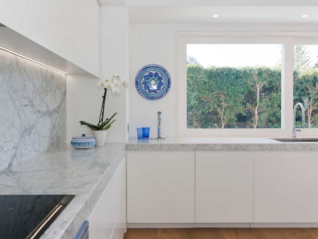 Glenn McGrath's new kitchen featuring CDK Stone cararra marble stone benchtop, made by Benchmark Stonemasons, Sydney