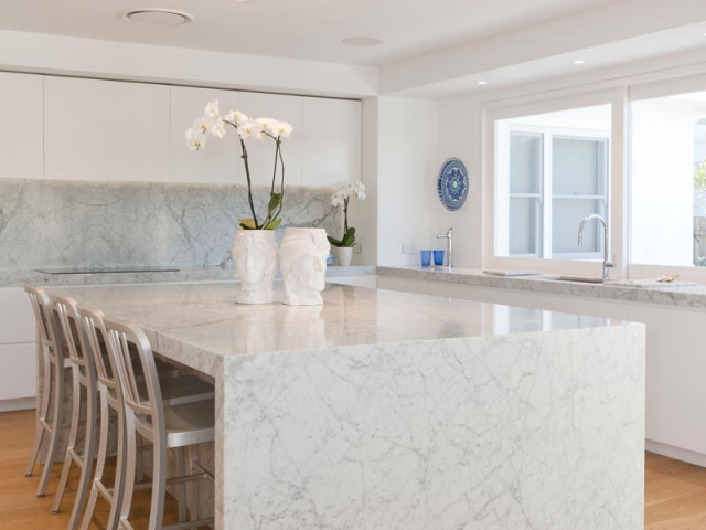 Glenn McGrath's new kitchen featuring CDK Stone cararra marble stone benchtop, made by Benchmark Stonemasons, Sydney