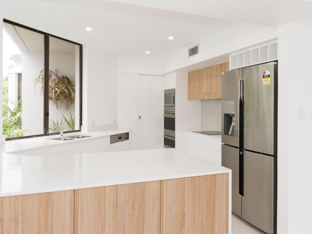 Quantum Quartz Luna White kitchen benchtop. Manly apartment renovation by Reno Pack.