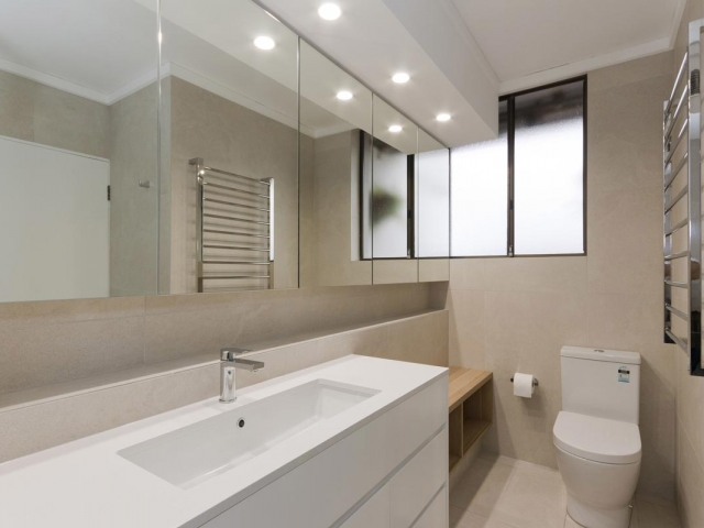 Quantum Quartz Luna White bathroom vanity benchtop. Manly apartment renovation by Reno Pack.