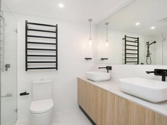 Smart Stone Cararra benchtop on custom made bathroom vanity. Unit renovation by Living Space Constructions.