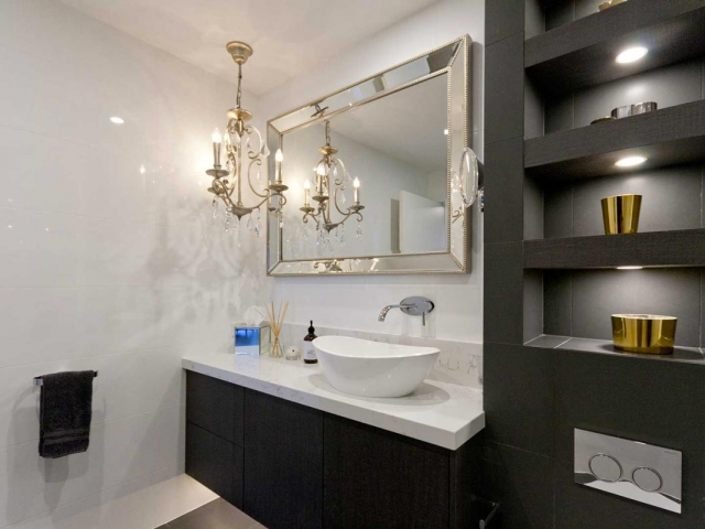 Custom made bathroom vanity featuring Quantum Quartz Statuario Quartz benchtop and splashback. Amalfi above counter basin by Victoria & Albert.