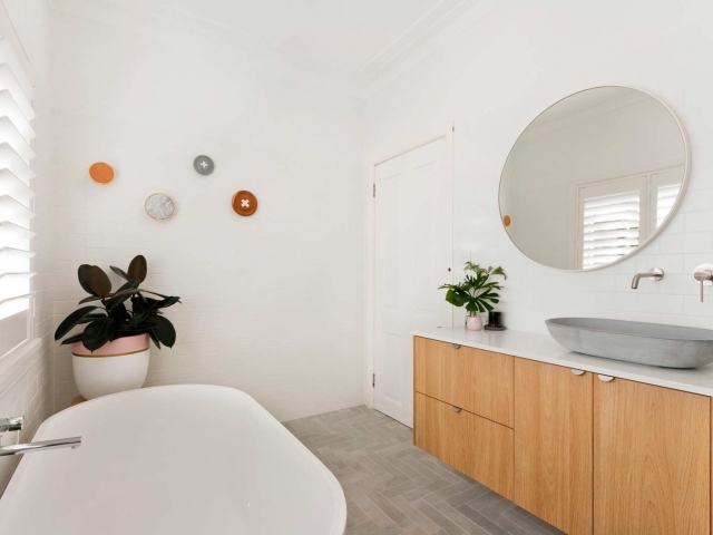 Bathroom vanity with Quantum Quartz Alpine White stone top. Bathroom renovation by Living Space Constructions.