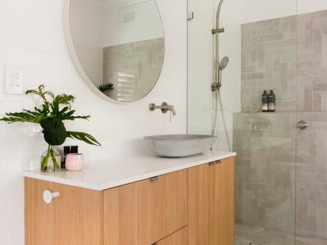 Bathroom vanity with Quantum Quartz Alpine White stone top. Bathroom renovation by Living Space Constructions.