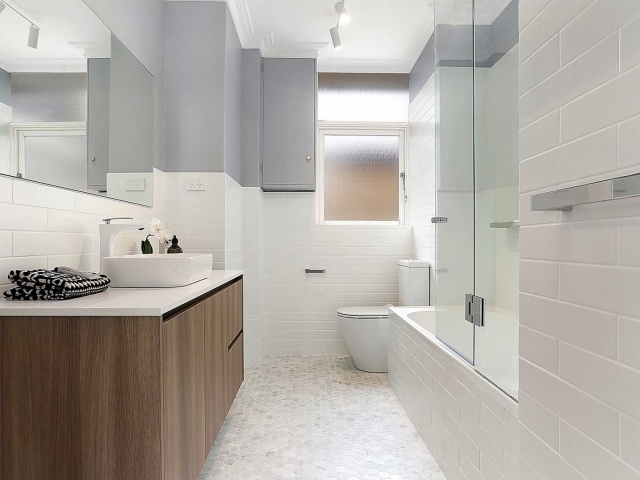 Custom made vanity with Caesarstone Pure White stone top, Caroma Luna above counter basin, Paco Jaanson tapware and toilet.