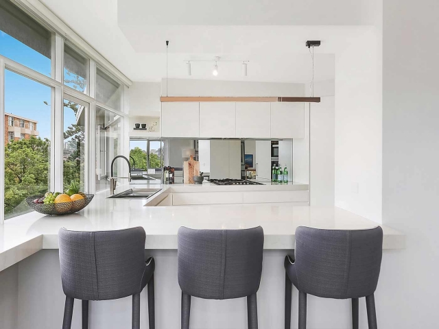 Quantum Quartz kitchen bench in Carrara Quartz, Miele appliances and sink and mixer by Sterling.