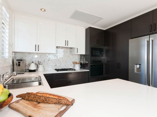 Quantum Quartz Alpine White stone kitchen bench. Unit renovation by Living Space Constructions.